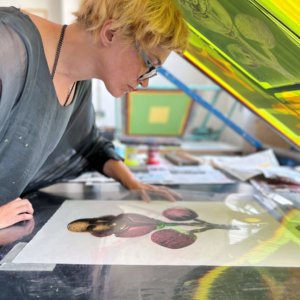 Elizabeth making a print in the print workshop