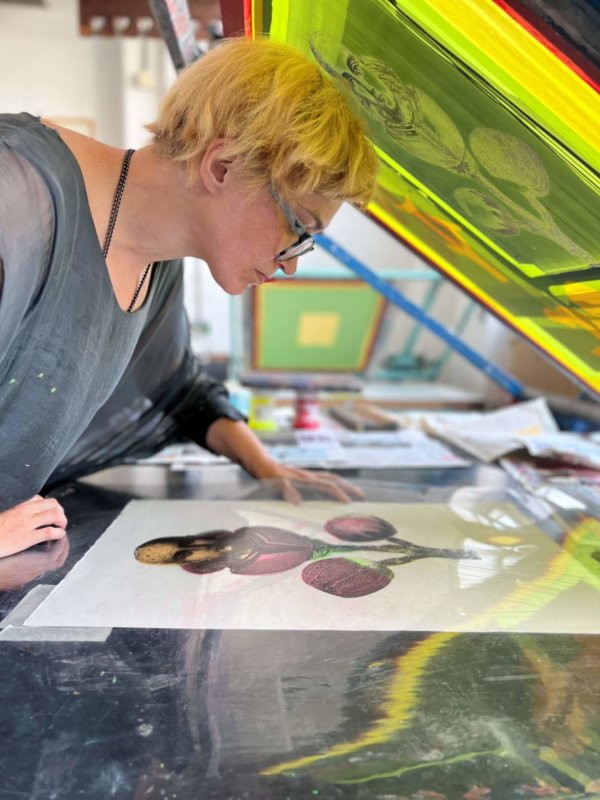 Elizabeth making a print in the print workshop