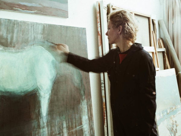 Eugenie Vronskaya painting in her studio