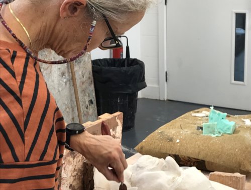 Heatherleys Sculpture Diploma student working on a plaster cast of a portrait head.