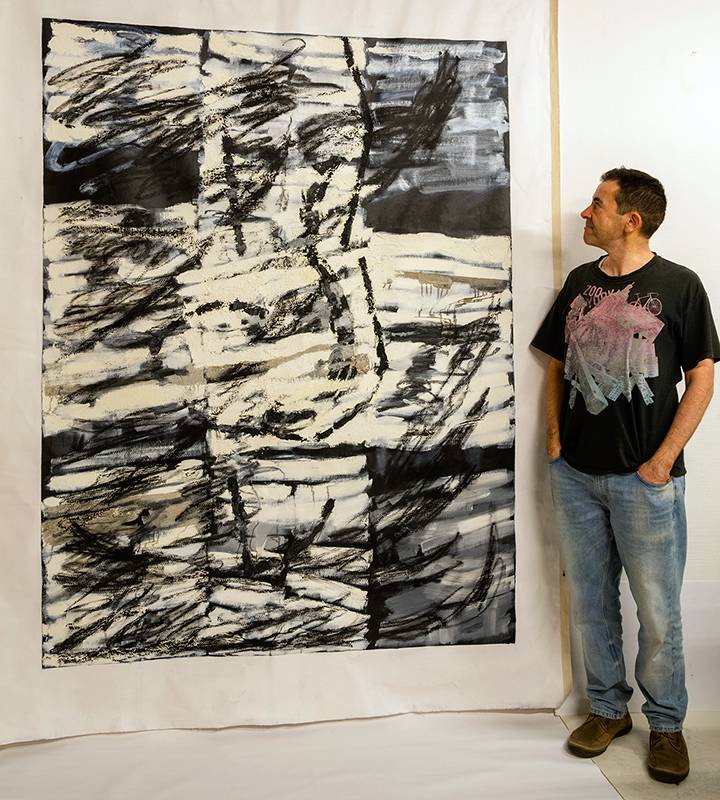 Post Diploma graduate Miguel Sopena with his painting Mycenae 5, oil impasto on unstretched canvas, 200x150 cm at The Stone Space.