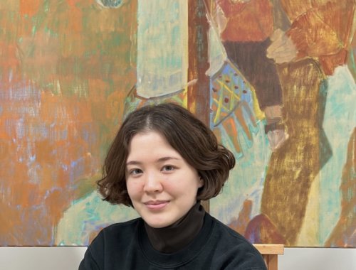 Artist and Heatherleys Portrait Diploma graduate Kayoon Anderson in front of her painting Merry go round
