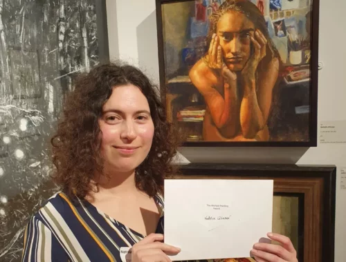 Natalia Glinoer with her painting In the Artist’s Studio