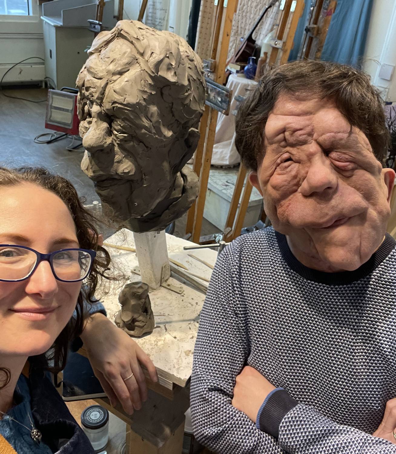 Adam Pearson and sculptor Keziah Burt and her portrait bust of Adam.